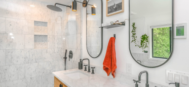 modern looking bathroom with 2 mirrors
