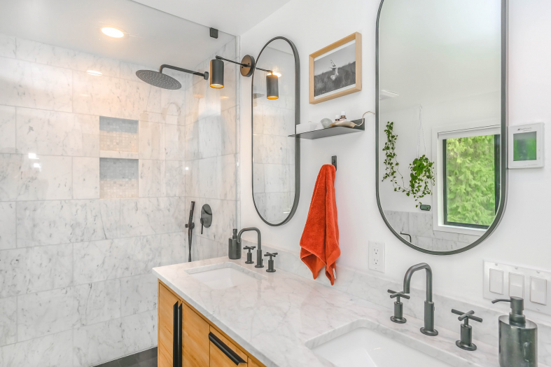 modern looking bathroom with 2 mirrors