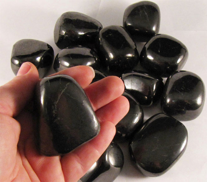 elite shungite stone in hand