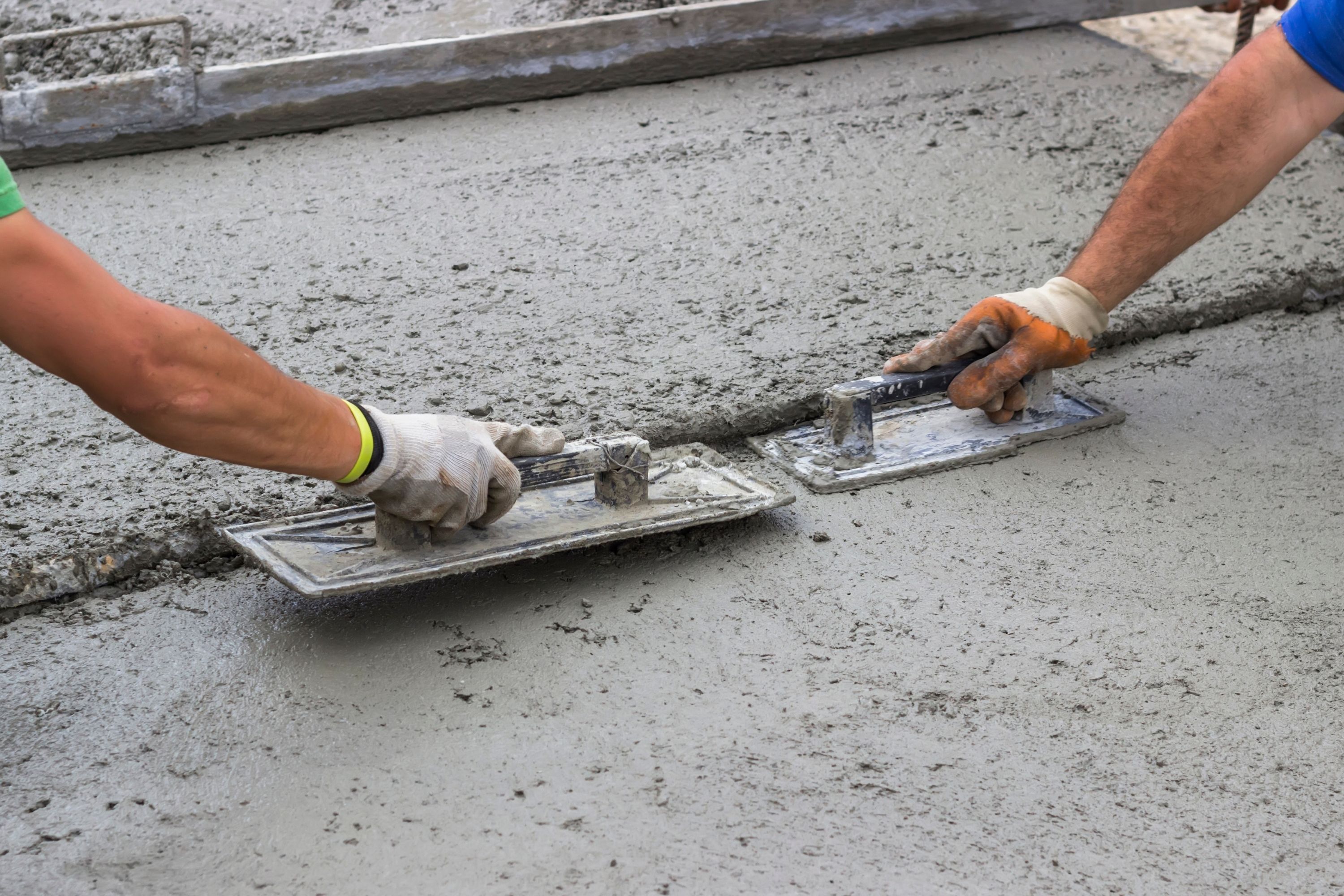 how long after pouring concrete can dogs walk on it