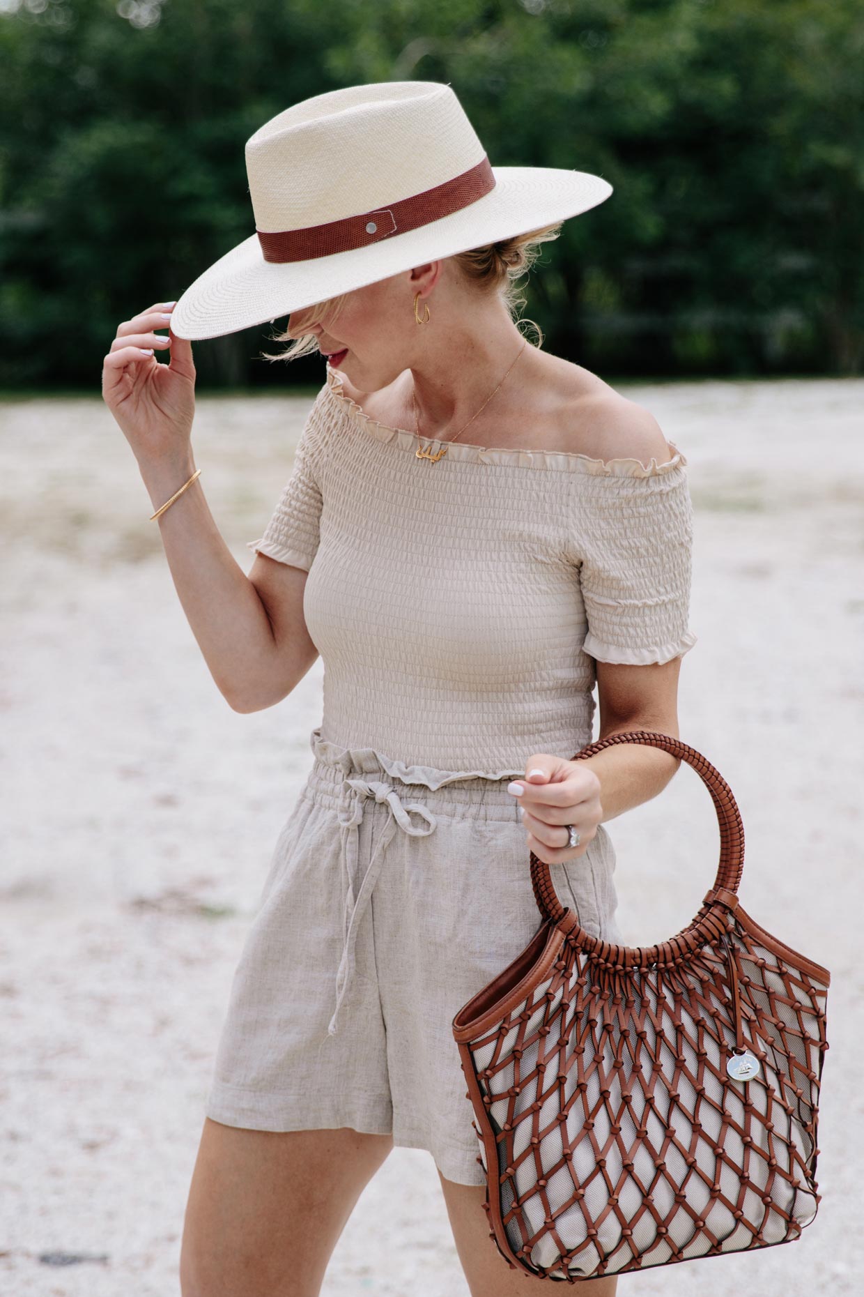 Meagan Brandon fashion blogger of Meagans Moda wears Rag and Bone straw panama hat with off the shoulder top and linen shorts