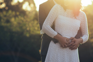 A couple embracing in a warm hug, symbolizing physical touch as a love language.