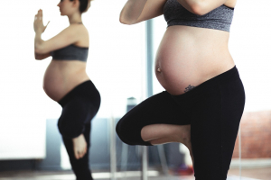 Two pregnant women standing