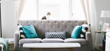 Minimalist lounge with light-colored sofa